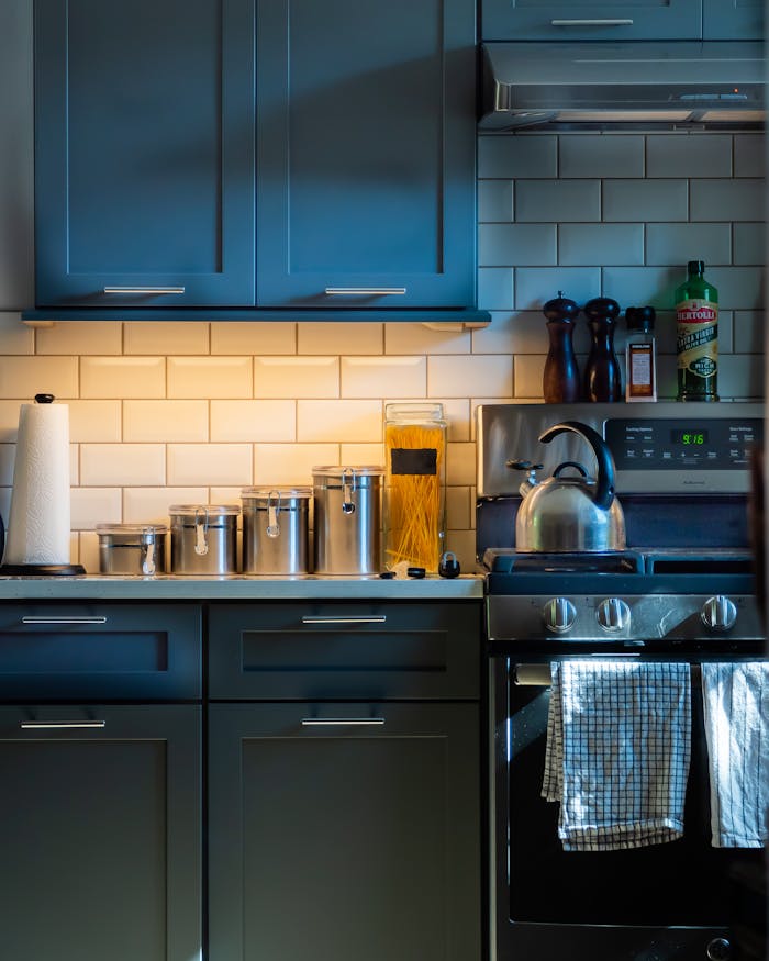our-services-2 A contemporary kitchen showcasing modern cabinetry and stainless steel appliances.